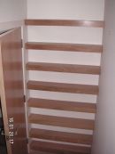 Oak veneered shelving, lipped with solid oak.