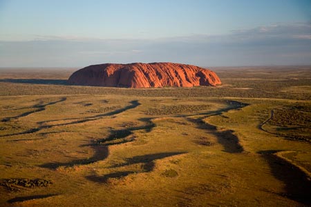 Late Afternoon Light on Uluru / Ayers Rock, Uluru - Kata Tjuta National Park, World Heritage Area, Northern Territory, Australia - aerial 