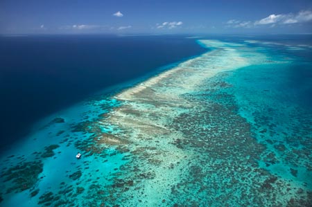 Tongue Reef and Yacht, Great Barrier Reef Marine Park, North Queensland, Australia - aerial 