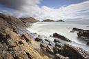 Rocky Shore And Mumbles Lighthouse