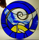 Tiffany stained glass window hanging by David Huchinson.