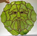 Tiffany stained glass green man window hanging by Gary Carr.